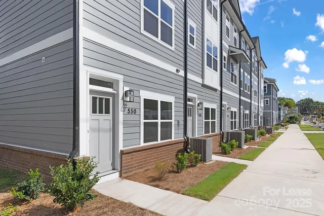 a view of a building with a yard