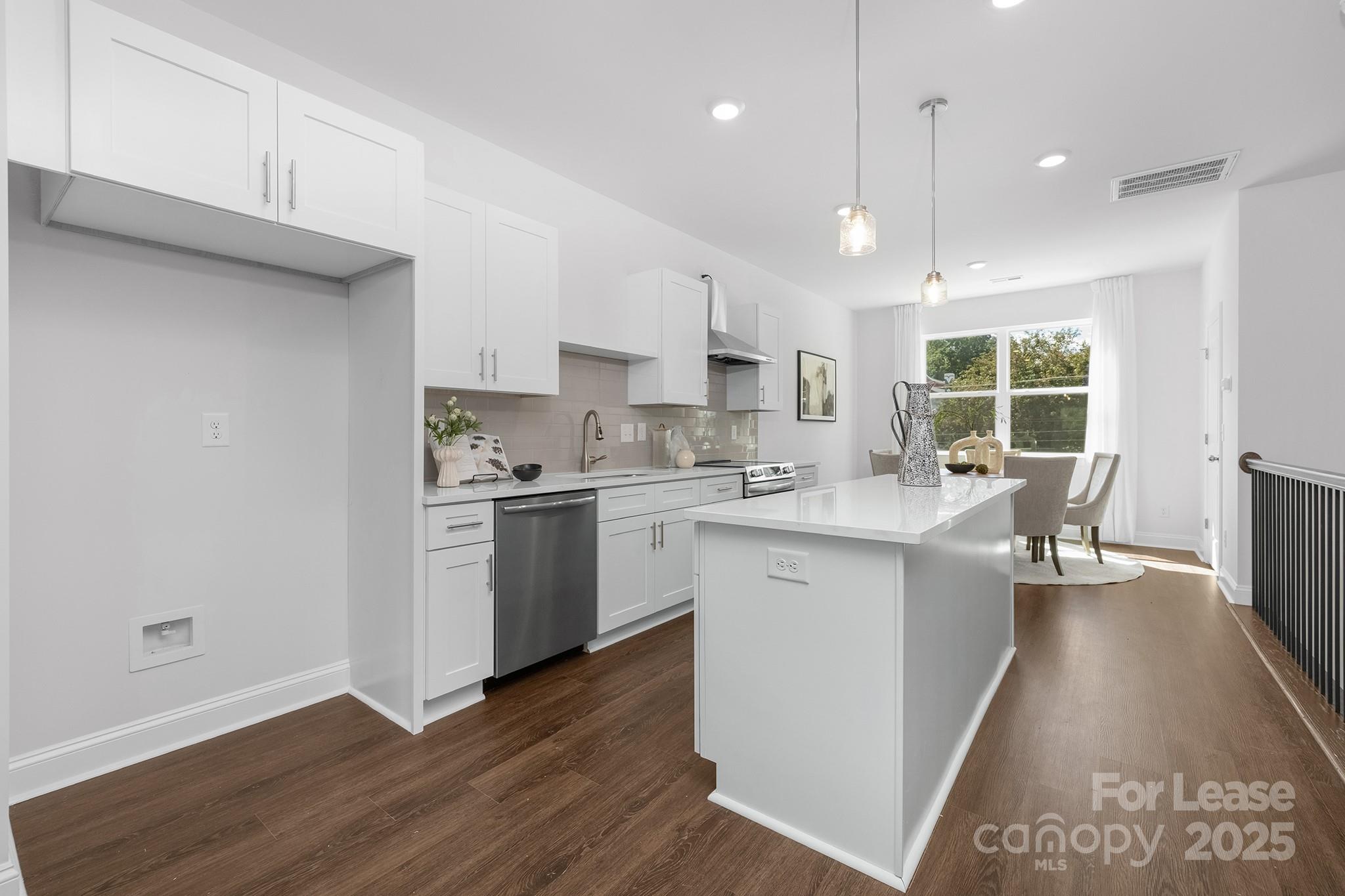550 Beatties Ford Road Charlotte, NC 28216 - Photo 5 of 23 a kitchen with a sink cabinets stainless steel appliances and a window