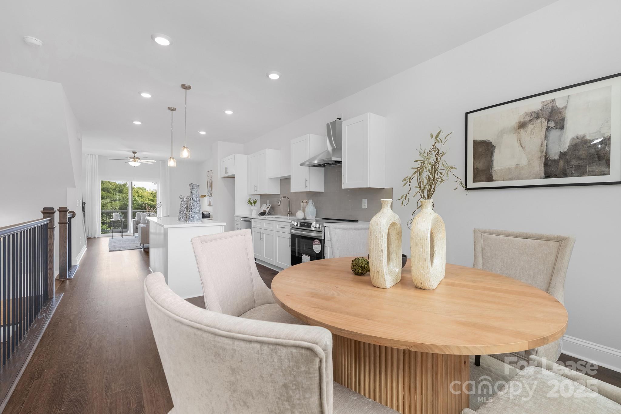 550 Beatties Ford Road Charlotte, NC 28216 - Photo 6 of 23 a dining room with furniture and a kitchen view