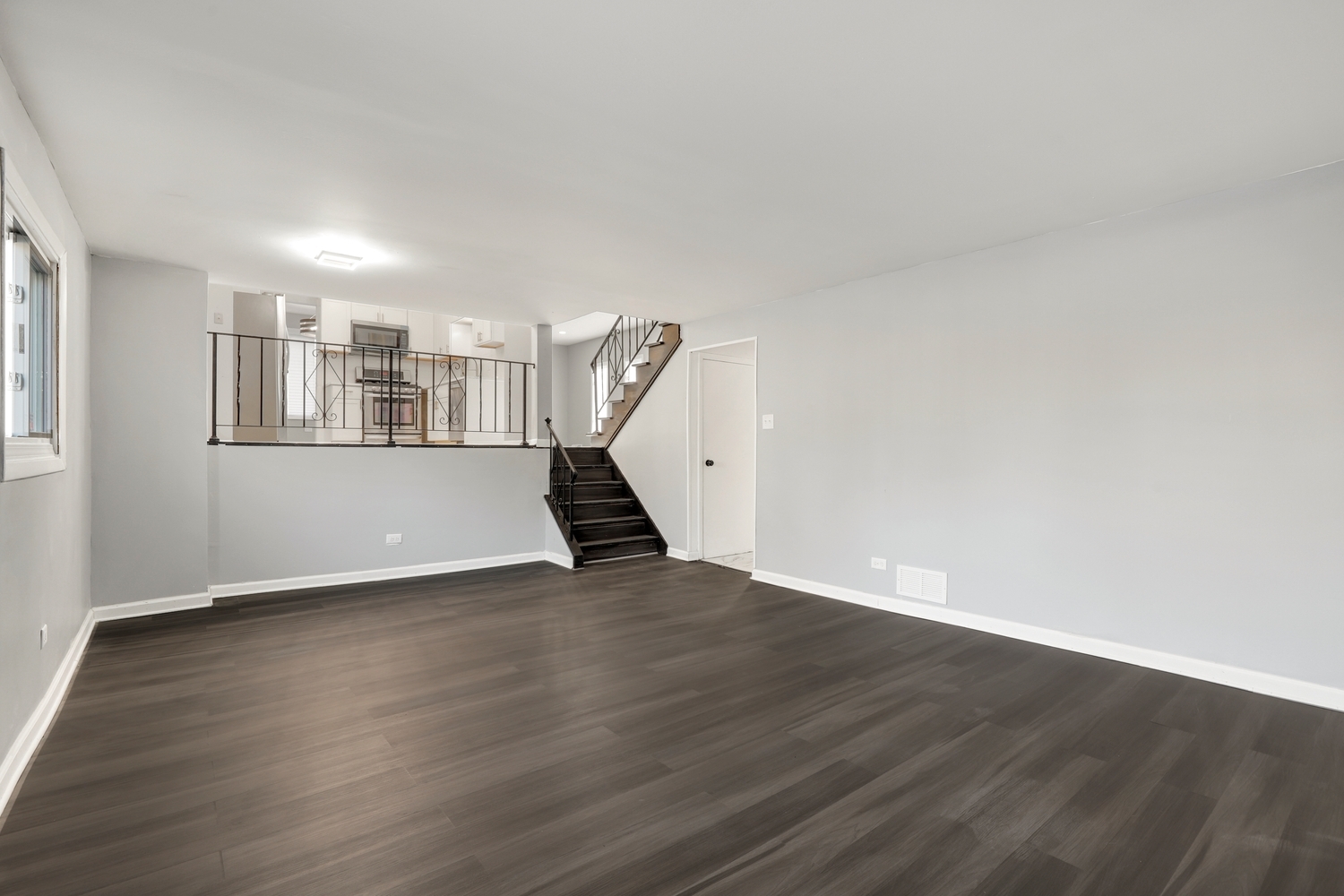 3518 South Manor Drive Lansing, IL 60438 - Photo 20 of 27 an empty room with wooden floor and windows