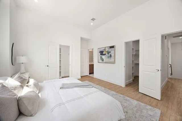 a bedroom with a bed and a cabinets