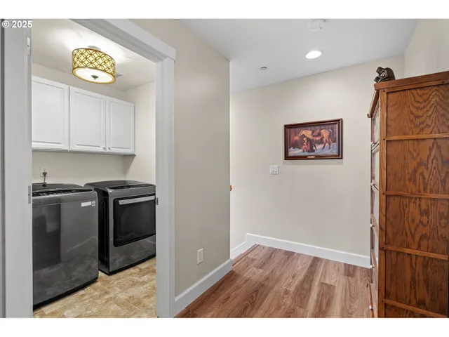 a kitchen with stainless steel appliances granite countertop a refrigerator and a stove