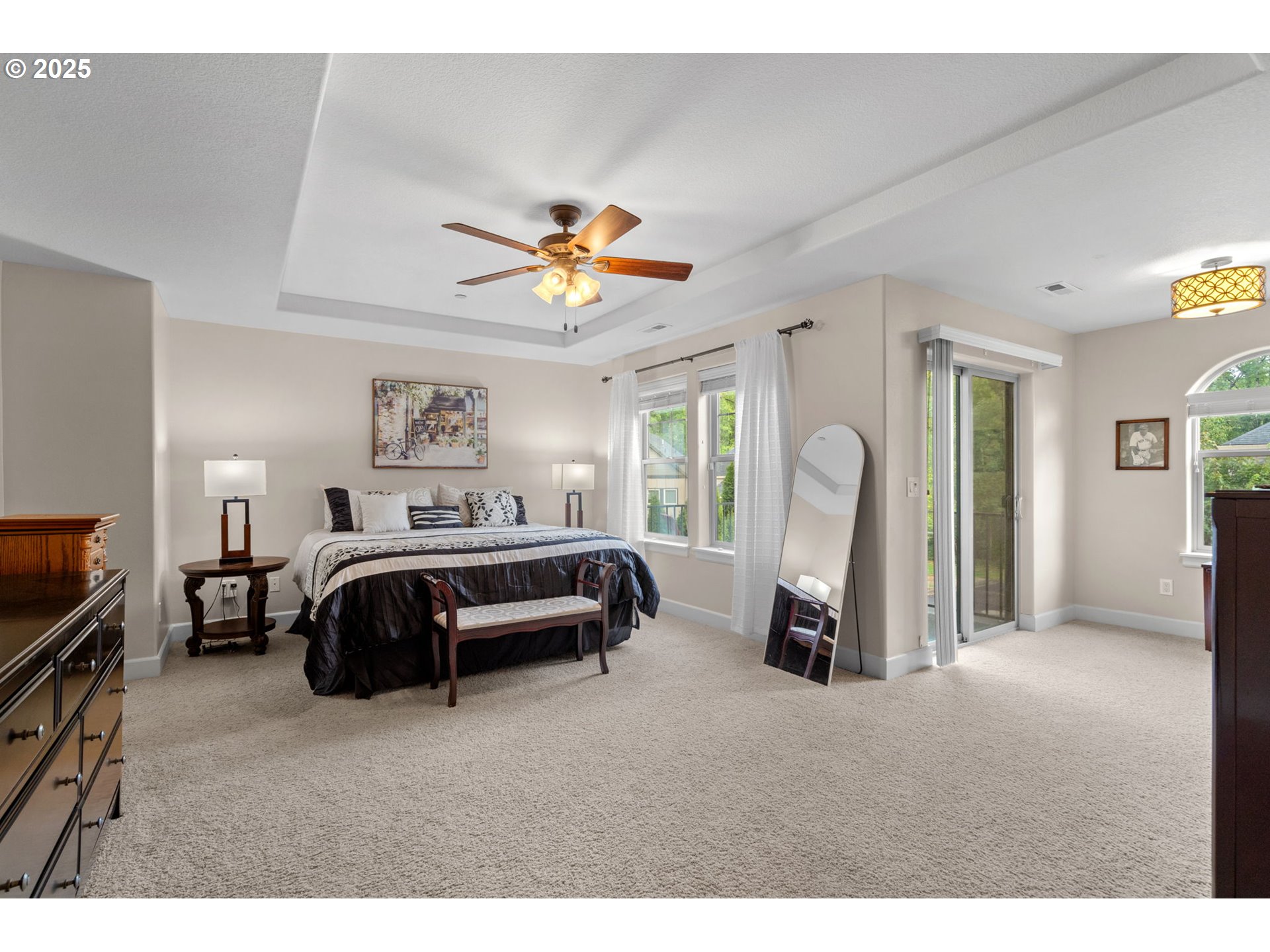 5717 Northwest 26th Avenue Camas, WA 98607 - Photo 17 of 35 a bedroom with a bed and a chandelier