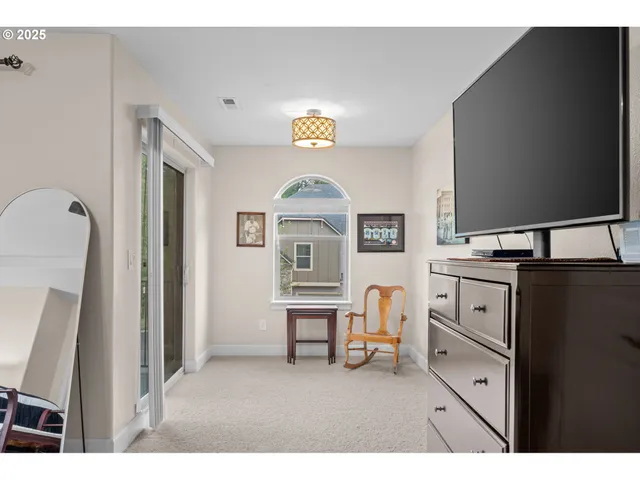 a view of living room with furniture and a flat screen tv