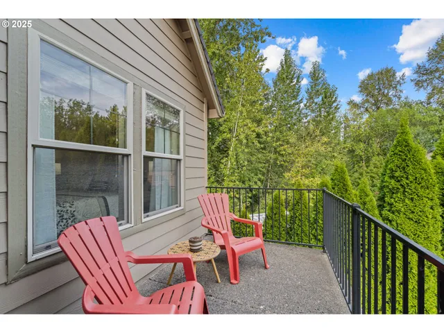 a view of a balcony with furniture