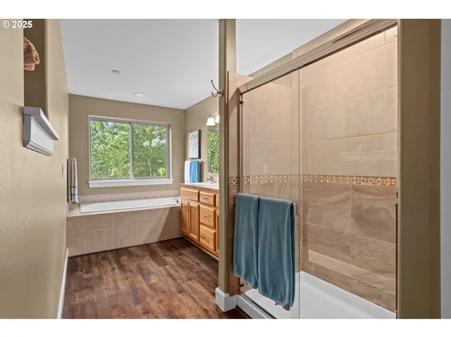 a bathroom with a bathtub and a window