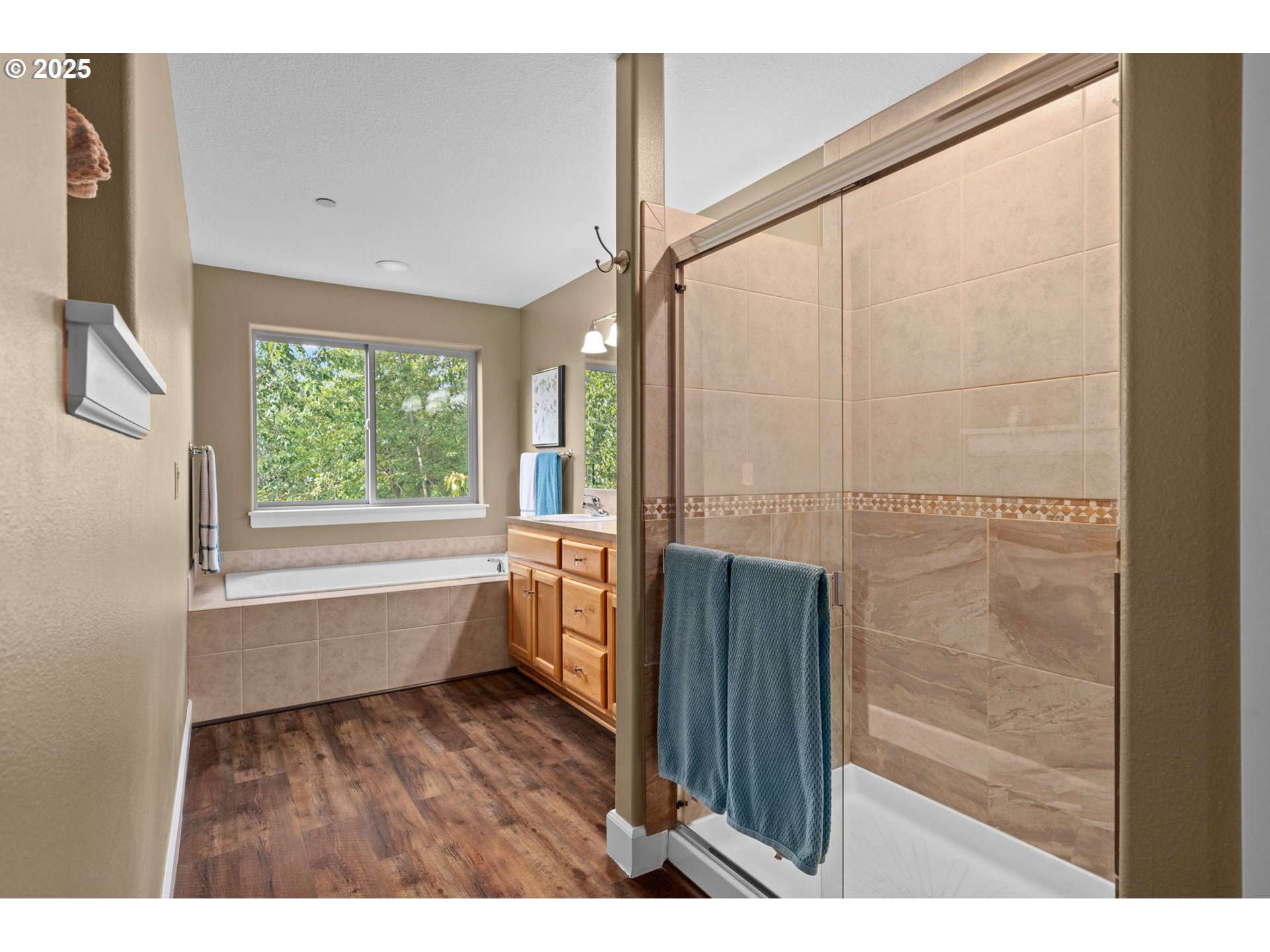 5717 Northwest 26th Avenue Camas, WA 98607 - Photo 24 of 35 a bathroom with a bathtub and a window