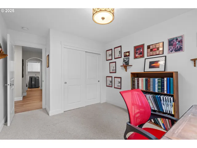 a view of a livingroom with furniture and workspace