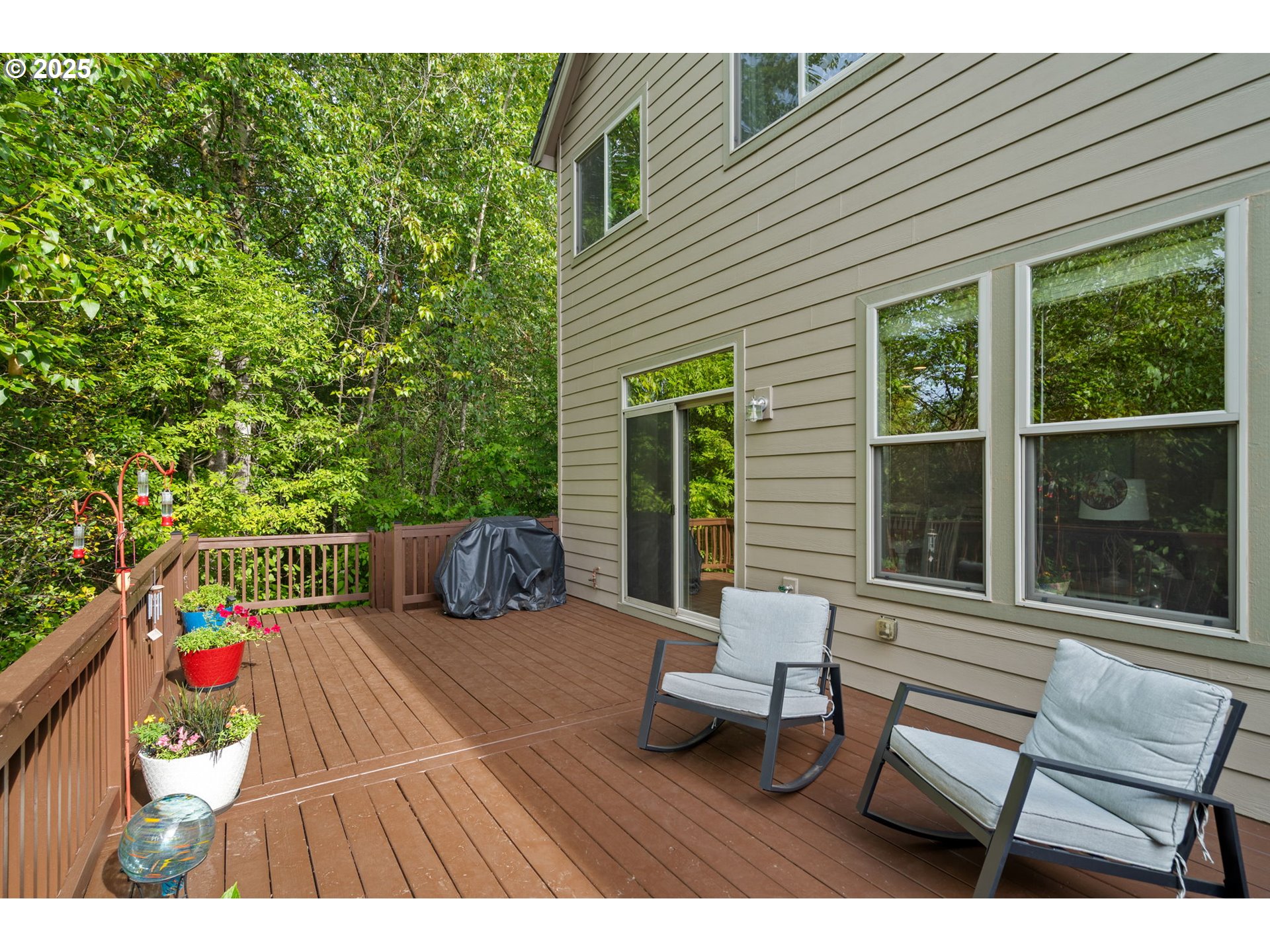 5717 Northwest 26th Avenue Camas, WA 98607 - Photo 34 of 35 a view of a chairs and table in the back yard of the house
