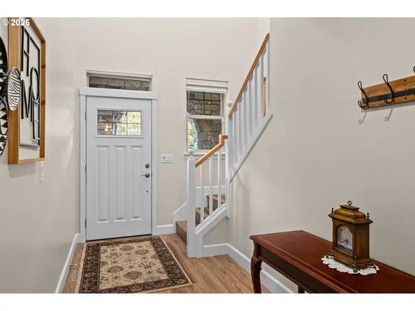 a view of an entryway with wooden floor