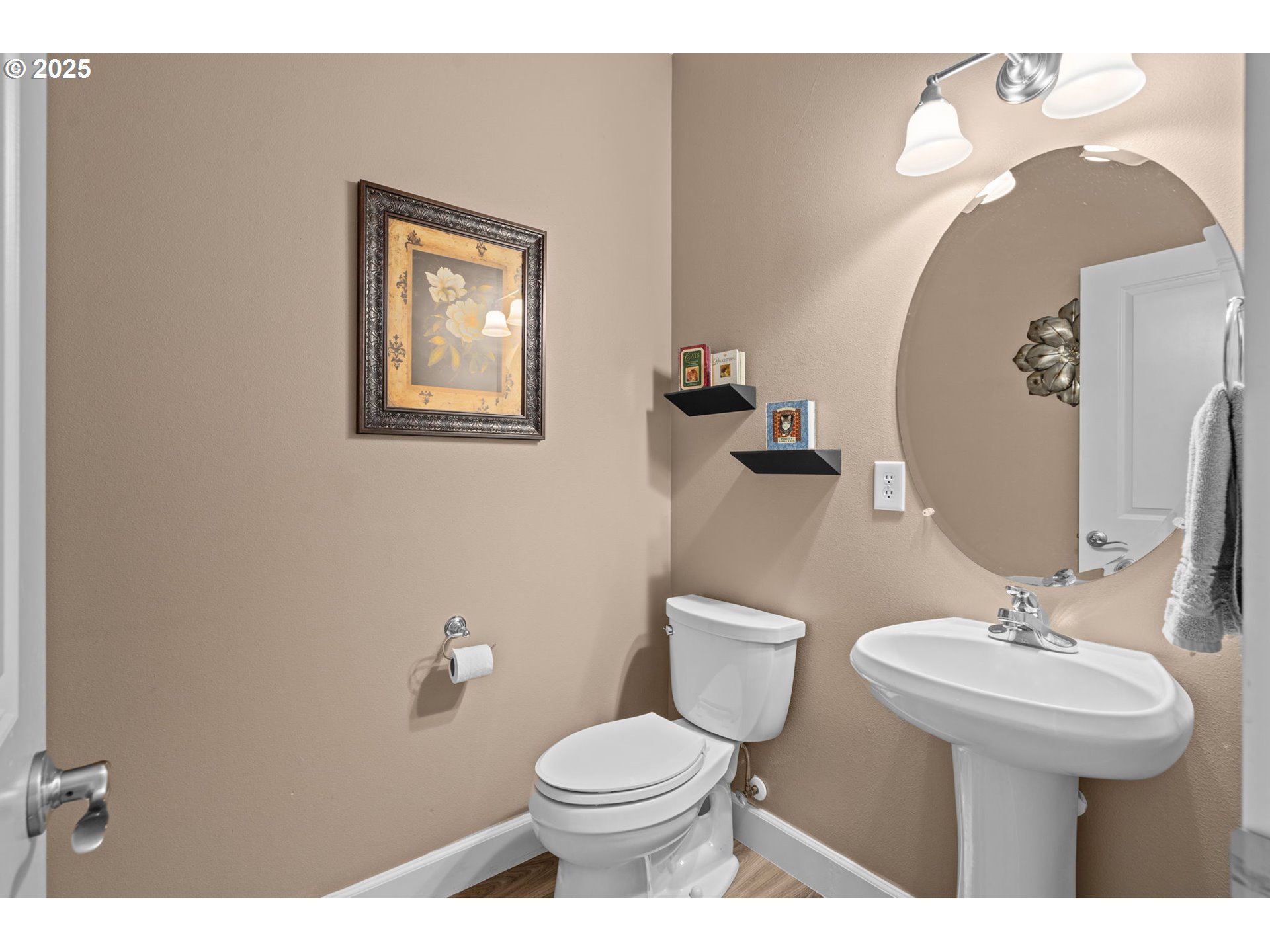 5717 Northwest 26th Avenue Camas, WA 98607 - Photo 5 of 35 a bathroom with a toilet sink and mirror