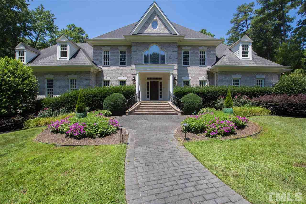 8423 Bournemouth Drive Raleigh, NC 27615 - Photo 2 of 30 a front view of a house with a garden