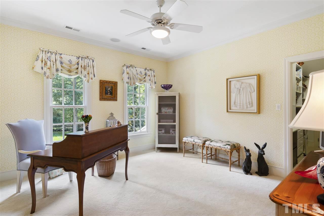 8423 Bournemouth Drive Raleigh, NC 27615 - Photo 14 of 30 a living room with furniture and a flat screen tv