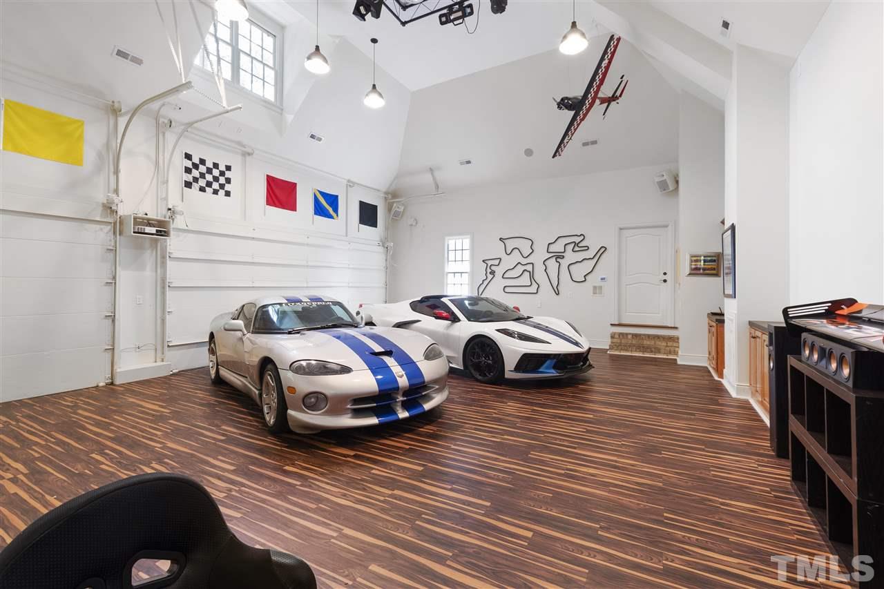 8423 Bournemouth Drive Raleigh, NC 27615 - Photo 16 of 30 a bedroom with a bed and wooden floor
