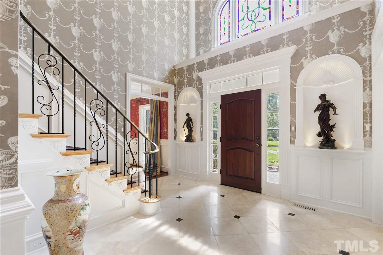 8423 Bournemouth Drive Raleigh, NC 27615 - Photo 3 of 30 a view of entryway and hall with wooden floor