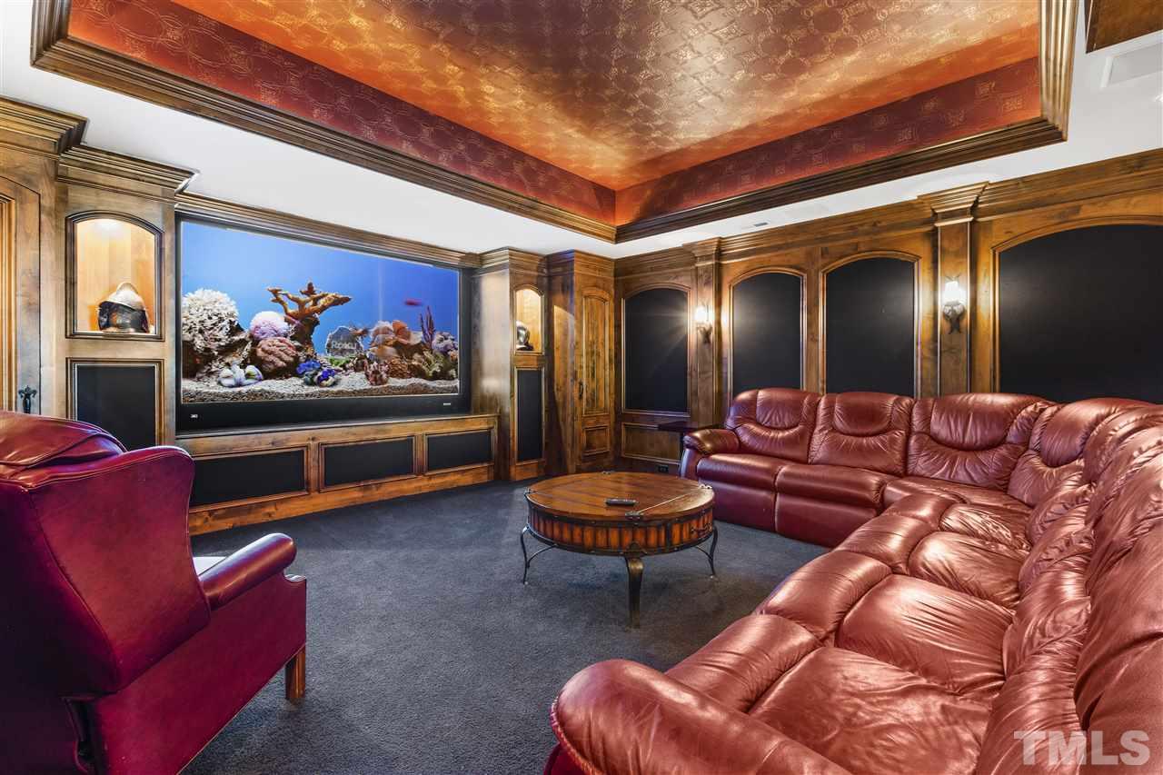8423 Bournemouth Drive Raleigh, NC 27615 - Photo 24 of 30 a living room with furniture and a rug