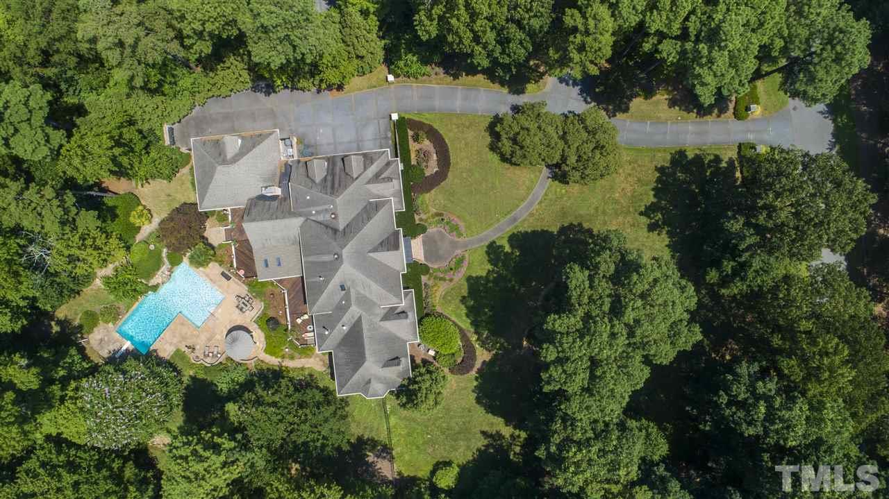 8423 Bournemouth Drive Raleigh, NC 27615 - Photo 30 of 30 an aerial view of a house with a swimming pool