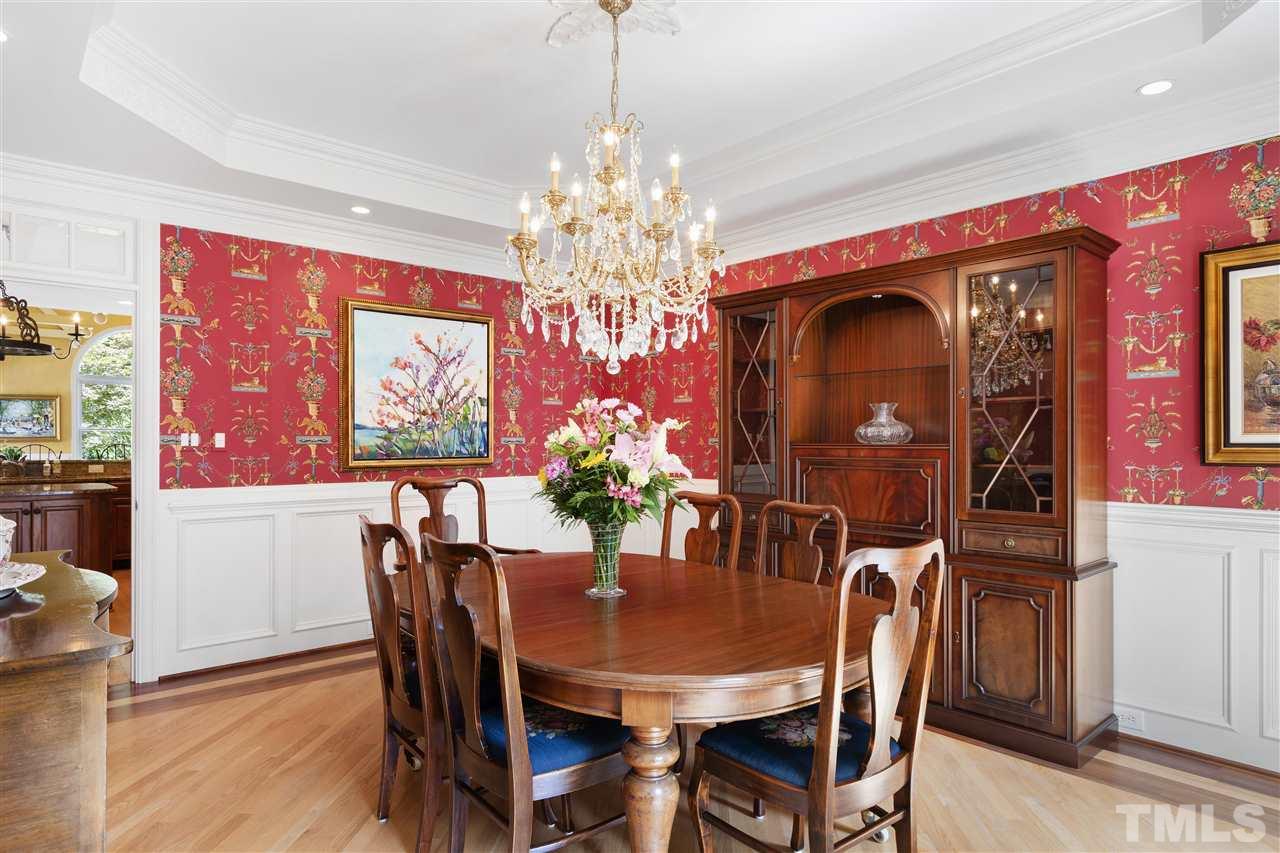 8423 Bournemouth Drive Raleigh, NC 27615 - Photo 5 of 30 a view of a dining room with furniture and chandelier