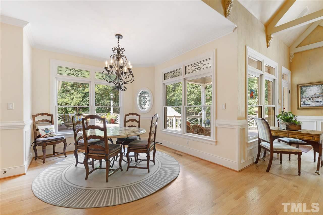 8423 Bournemouth Drive Raleigh, NC 27615 - Photo 9 of 30 a view of a dining room with furniture window and outside view