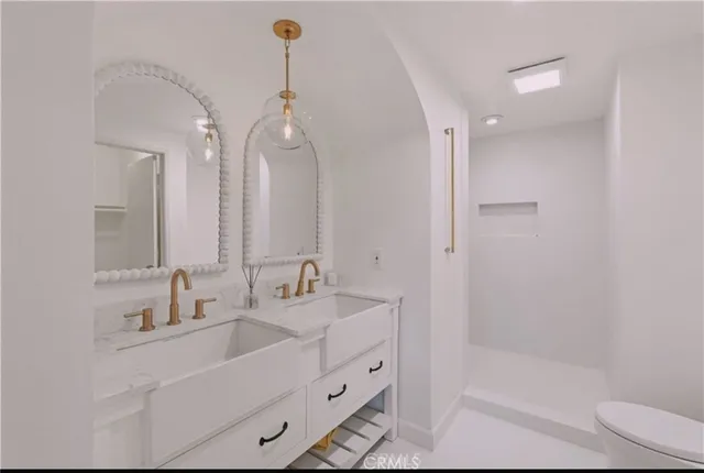a view of a patio with table and chairs under an umbrella