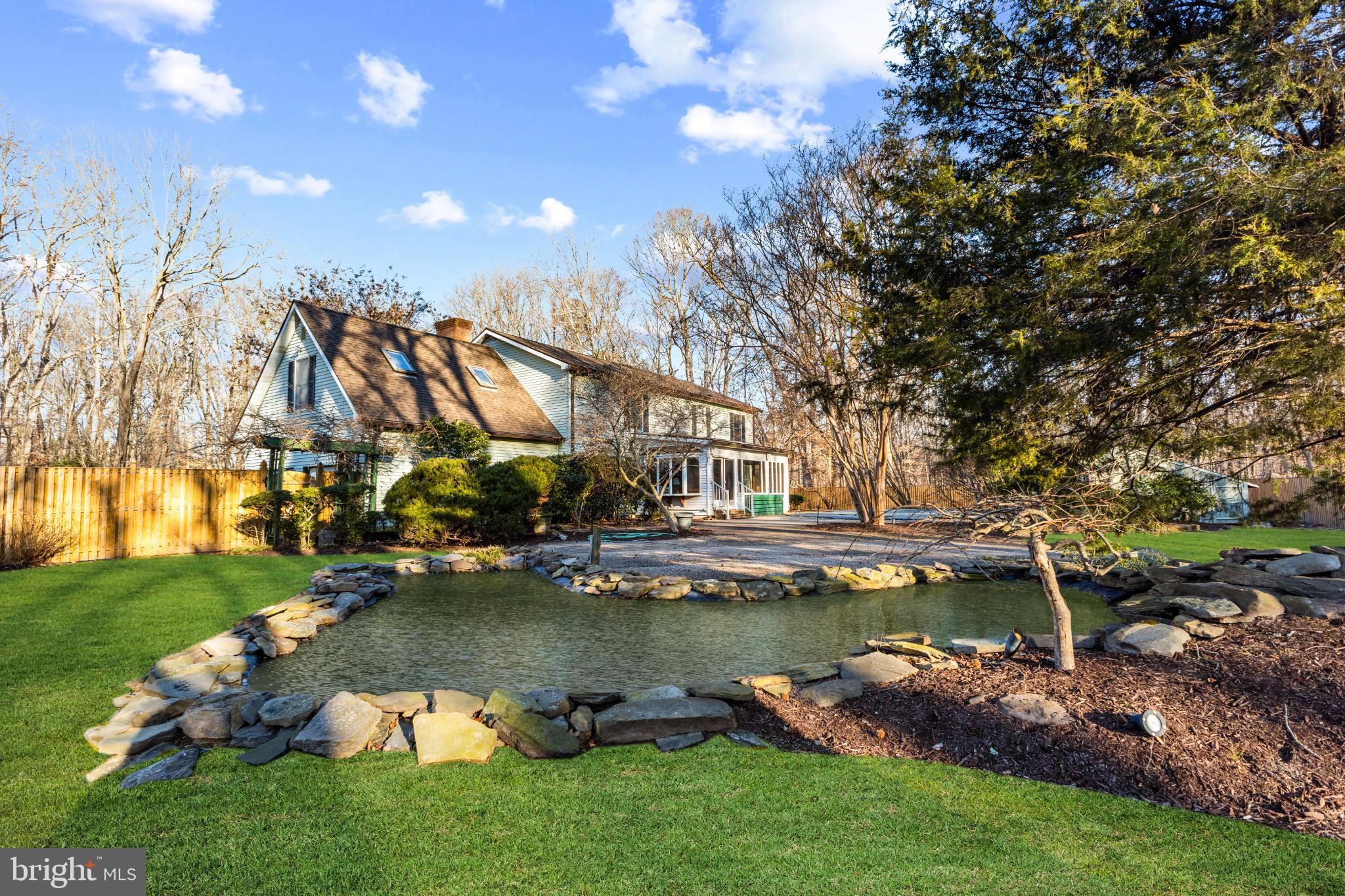 2107 Bennett Point Road Queenstown, MD 21658 - Photo 32 of 38 Koi pond with a waterfall (enhanced)