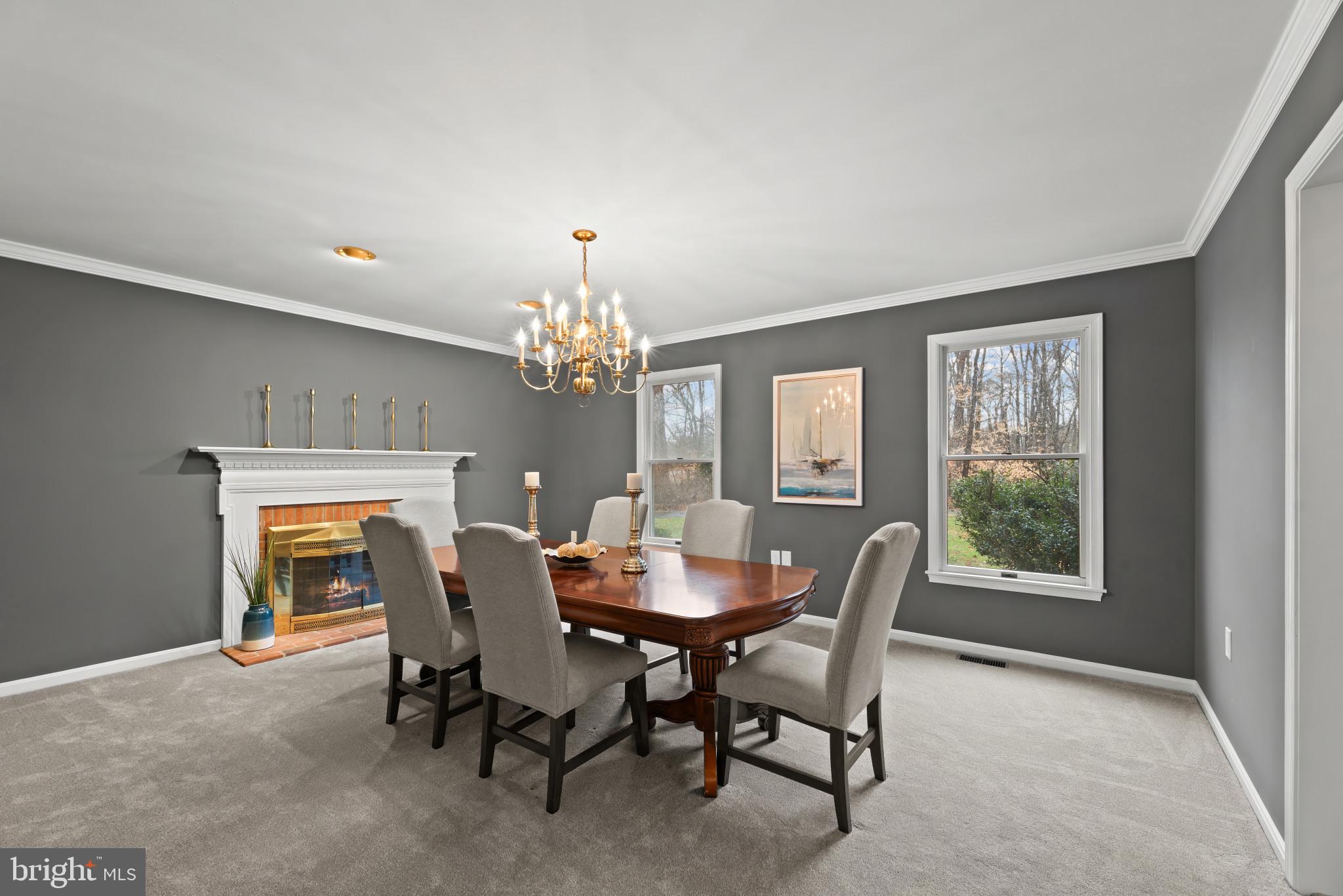 2107 Bennett Point Road Queenstown, MD 21658 - Photo 9 of 38 Dining Room with wood burning fireplace