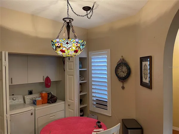 a kitchen with a refrigerator and a stove