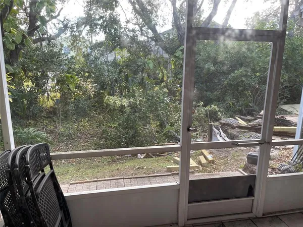 a view of a chair and table in the balcony