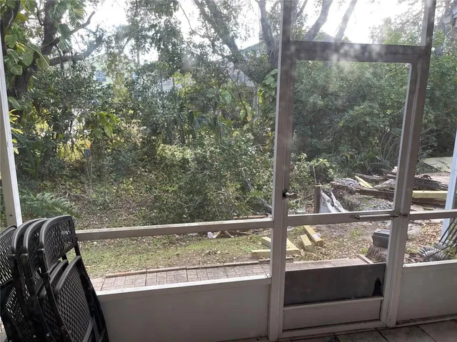 a view of a chair and table in the balcony