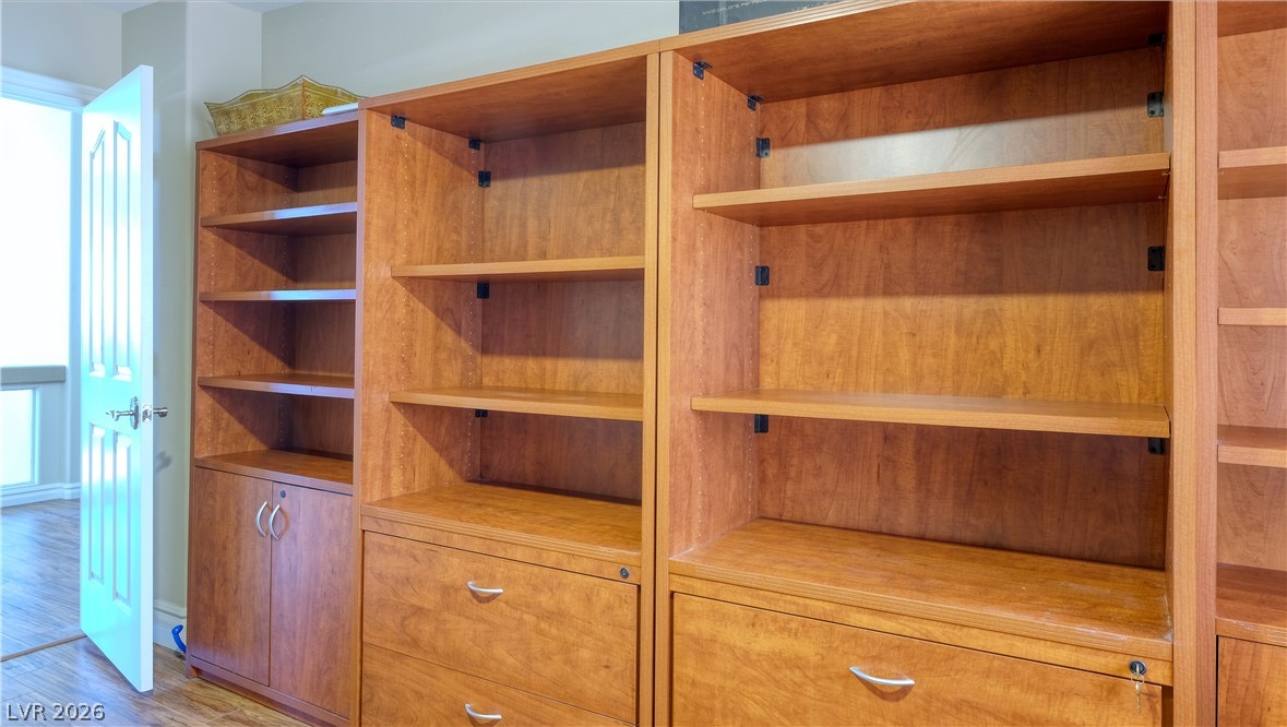 3704 North Campbell Road Las Vegas, NV 89129 - Photo 30 of 46 Custom-built shelving and cabinetry provide extensive storage in this versatile space.