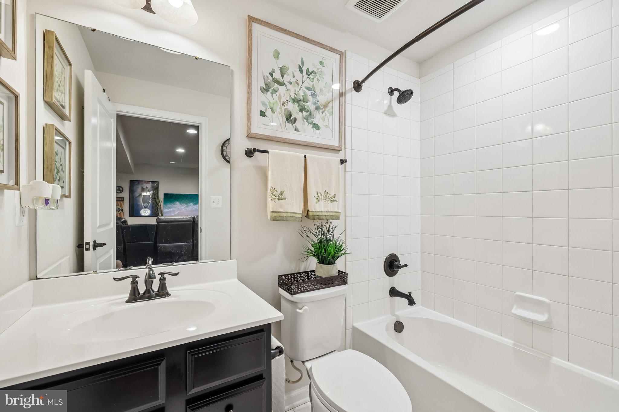 507 Potomac Road Joppa, MD 21085 - Photo 27 of 66 a bathroom with a sink a toilet and shower