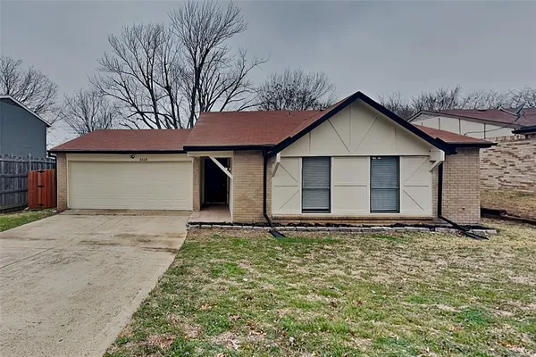 a house with trees in the background