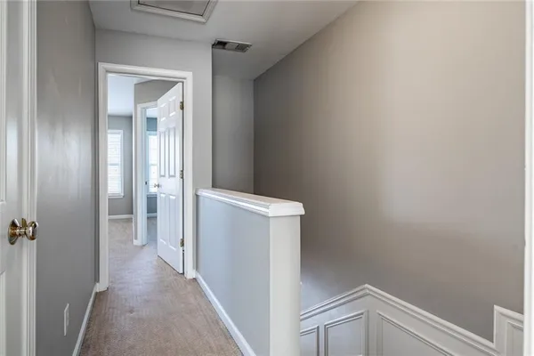 a view of a hallway with closet
