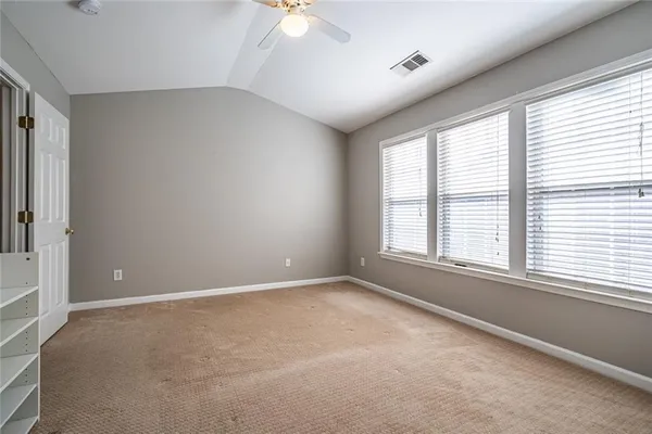 an empty room with a empty space and windows