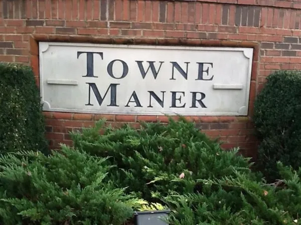 a sign broad in front of building