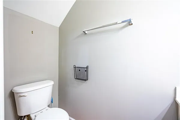 a white toilet sitting next to a white sink