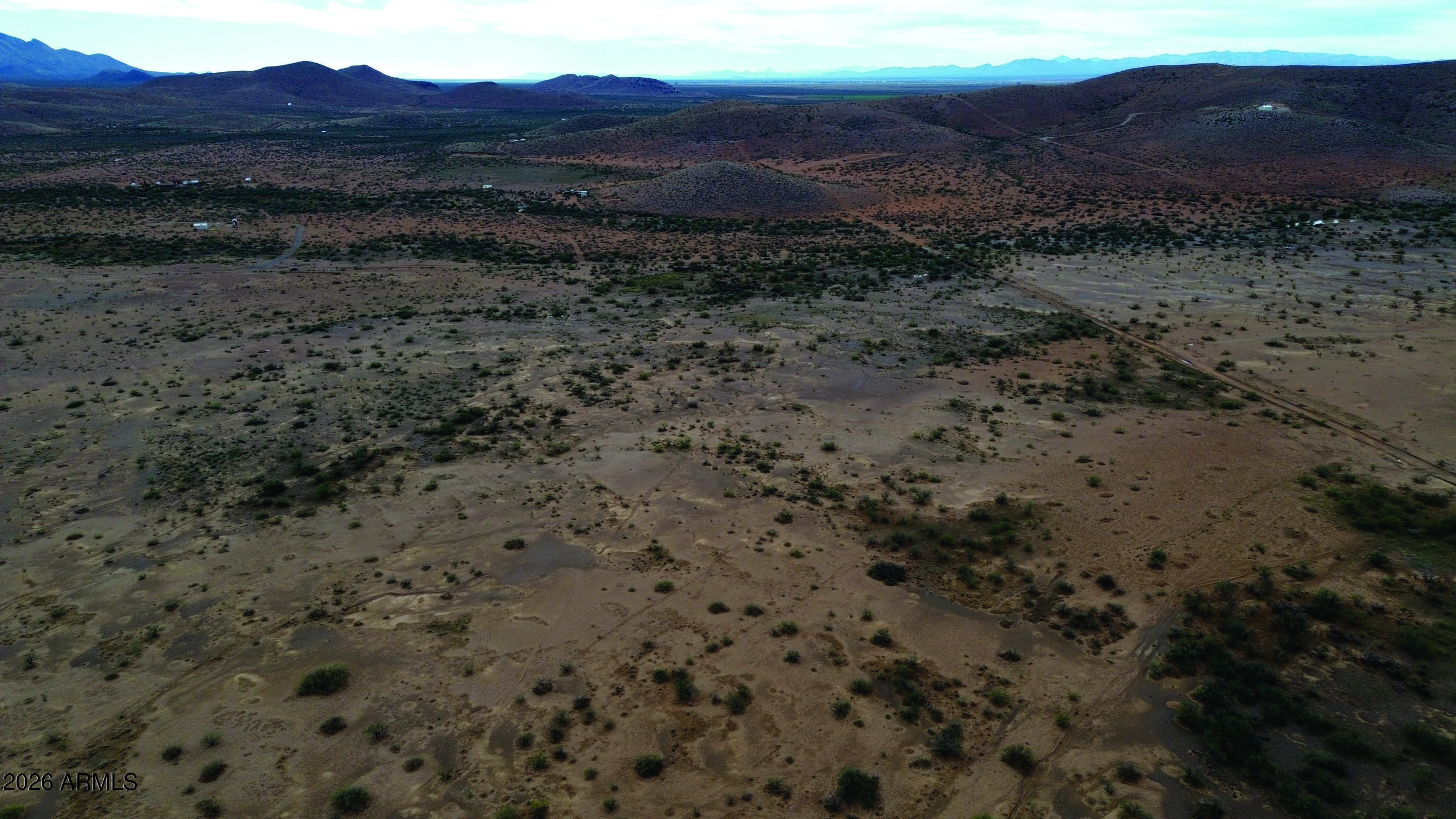 5-acres North Morgan Road, Unit E Pearce, AZ 85625 - Photo 8 of 21 a view of a dry field with mountains in the background