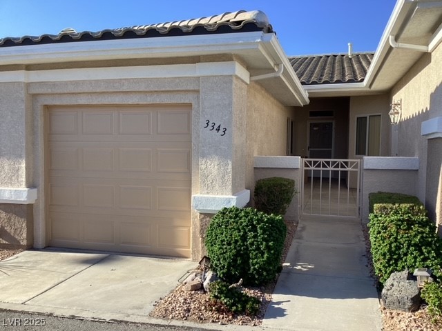 3343 Quail Song Drive Laughlin, NV 89029 - Photo 1 of 22 Doorway to property featuring a gate, stucco sidin