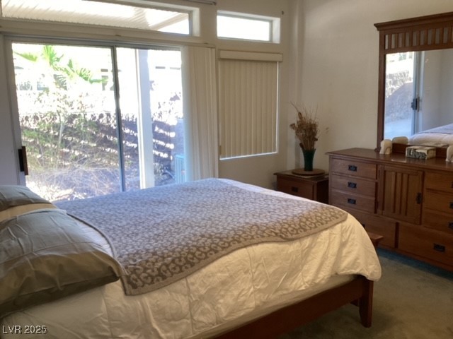 3343 Quail Song Drive Laughlin, NV 89029 - Photo 12 of 22 Carpeted bedroom with multiple windows and access