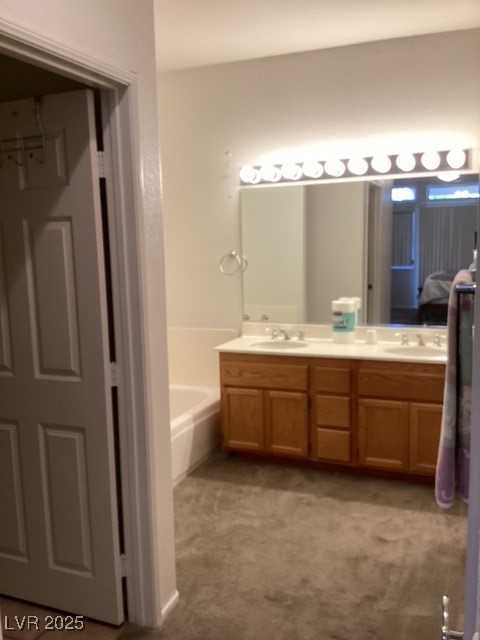 3343 Quail Song Drive Laughlin, NV 89029 - Photo 13 of 22 Ensuite bathroom with a bath, double vanity, and d
