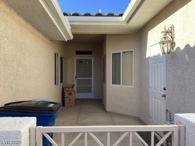 3343 Quail Song Drive Laughlin, NV 89029 - Photo 2 of 22 Entrance to property with stucco siding and a pati