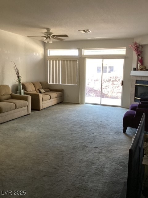 3343 Quail Song Drive Laughlin, NV 89029 - Photo 4 of 22 Carpeted living room with ceiling fan and a tiled