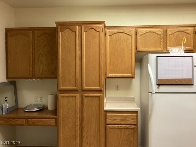 3343 Quail Song Drive Laughlin, NV 89029 - Photo 7 of 22 Kitchen with freestanding refrigerator, light coun
