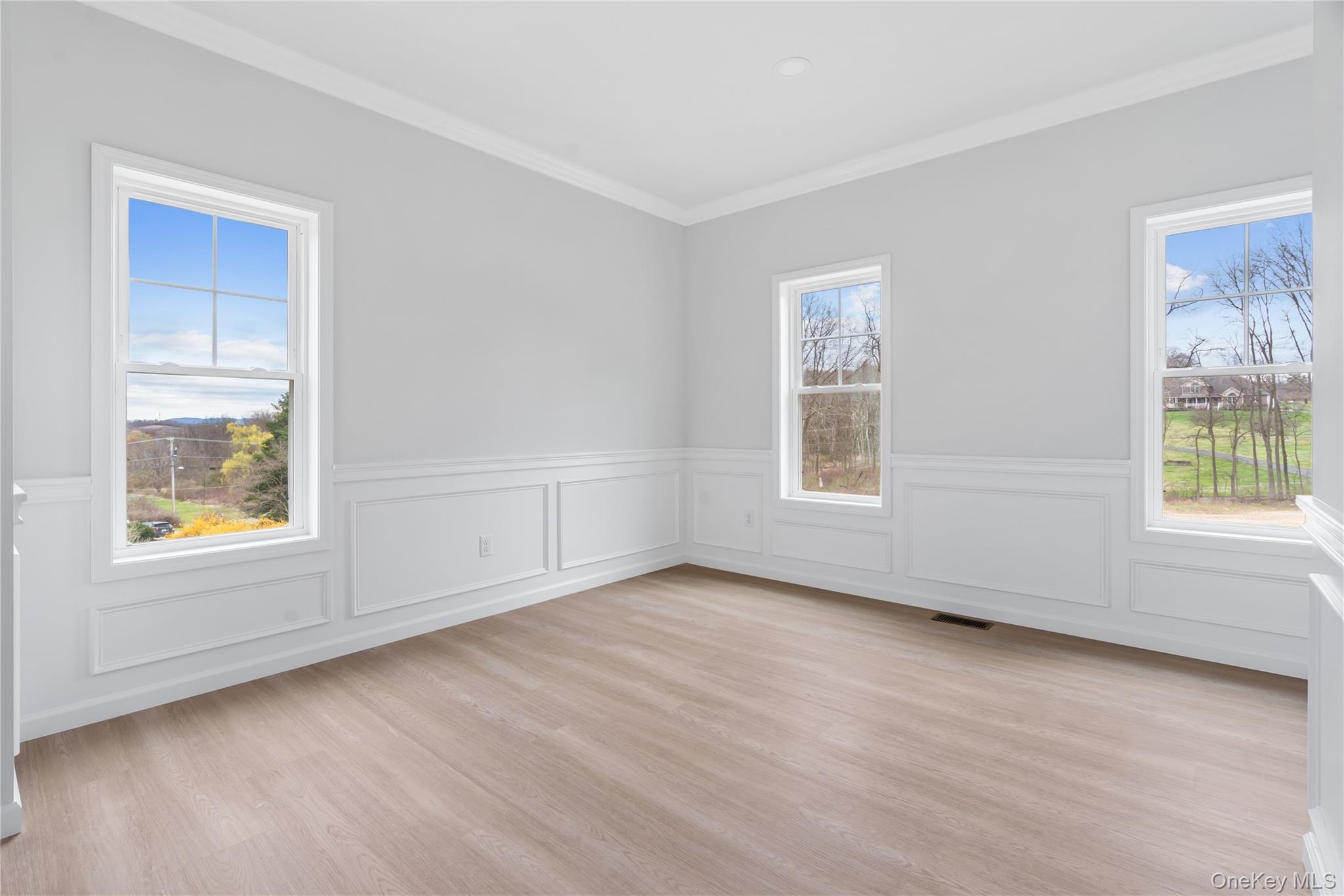 346 Old Hopewell Road Wappingers Falls, NY 12590 - Photo 14 of 42 an empty room with wooden floor and windows