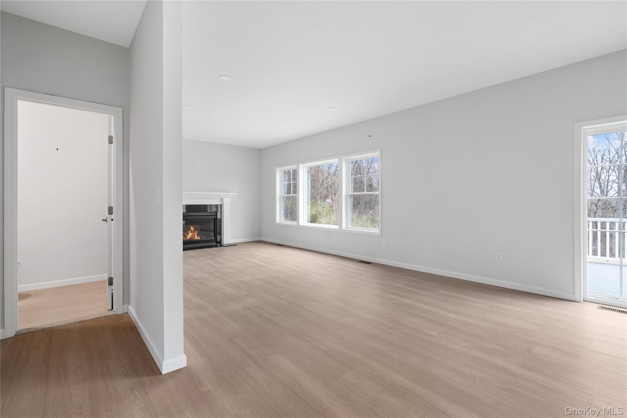 346 Old Hopewell Road Wappingers Falls, NY 12590 - Photo 16 of 42 an empty room with windows and fireplace