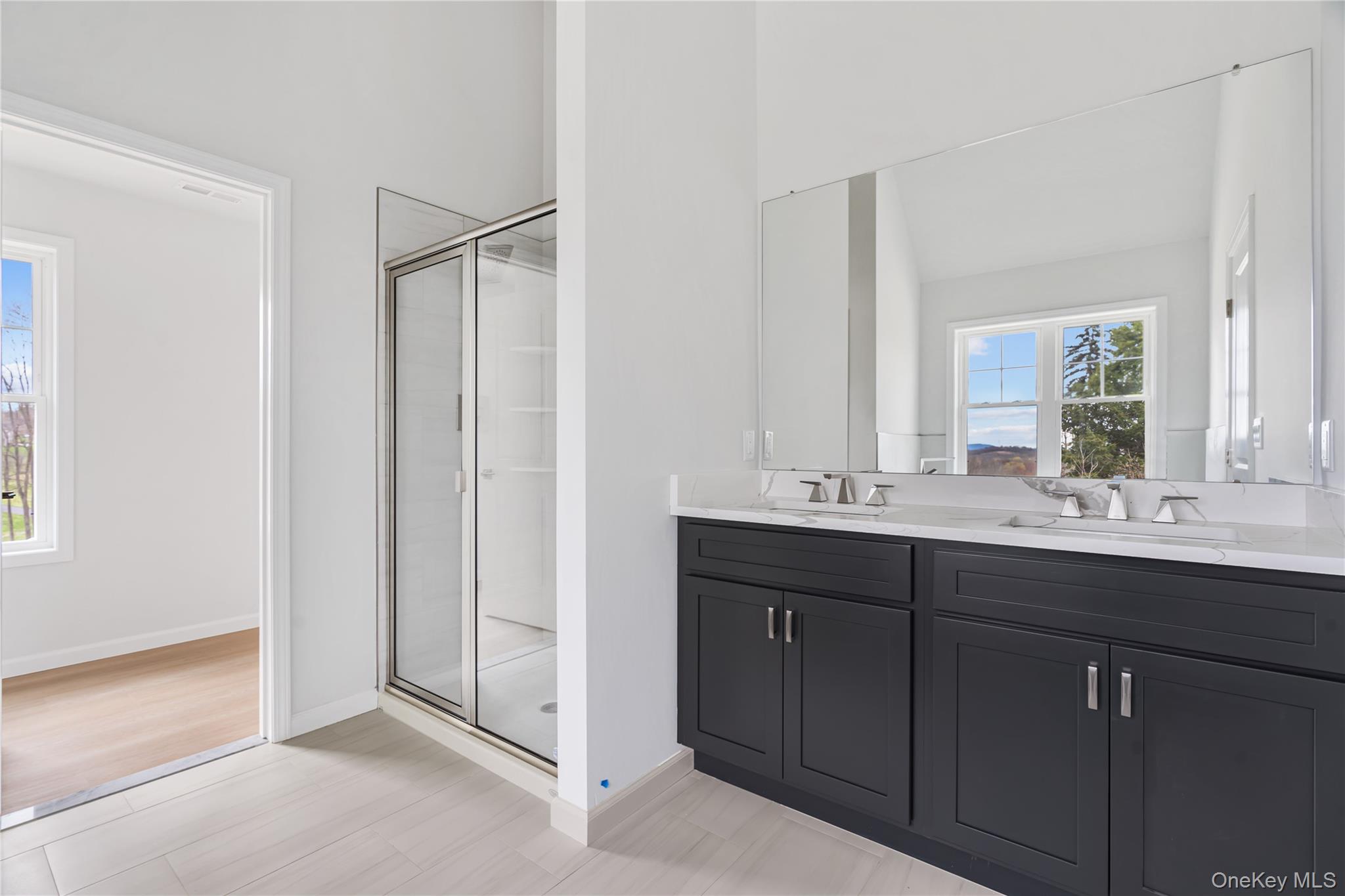 346 Old Hopewell Road Wappingers Falls, NY 12590 - Photo 22 of 42 a bathroom with a double vanity sink and mirror