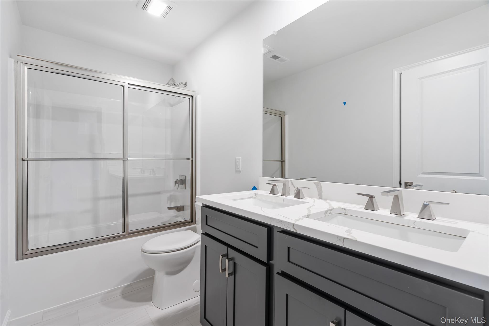 346 Old Hopewell Road Wappingers Falls, NY 12590 - Photo 33 of 42 a bathroom with a sink toilet vanity and shower