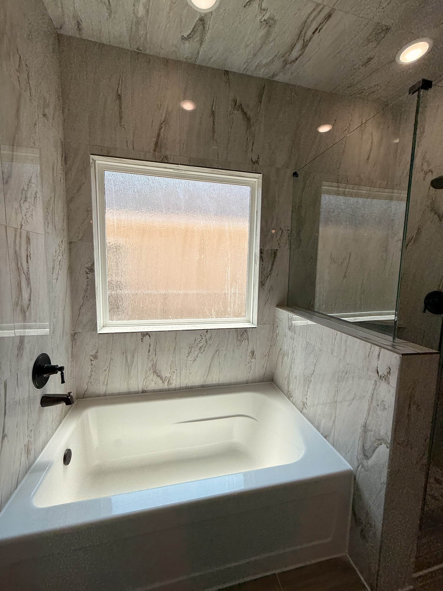 14844 Coaltown Road Willis, TX 77378 - Photo 6 of 30 a bathroom with a bathtub and a shower