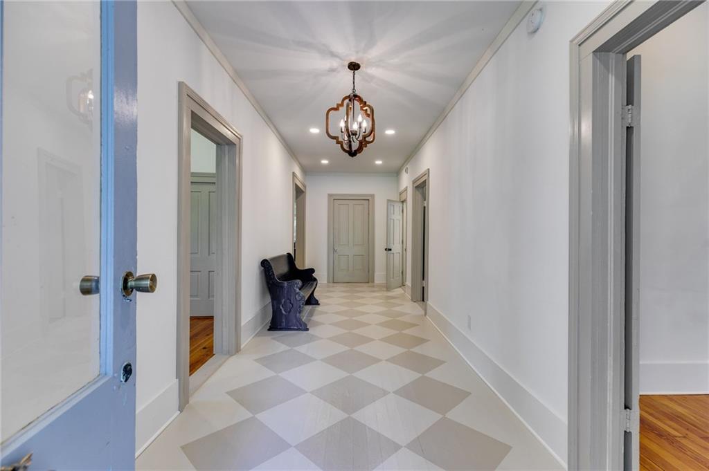 a very nice looking hallway with a chandelier