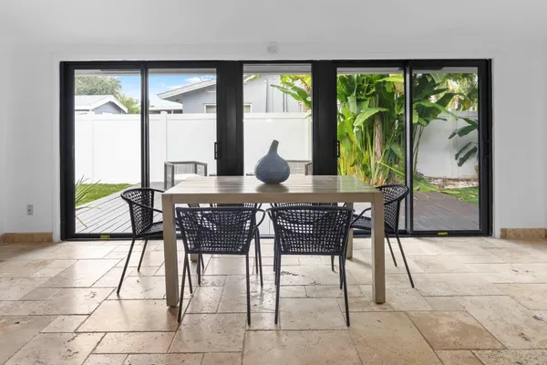 a view of a livingroom with furniture and a table